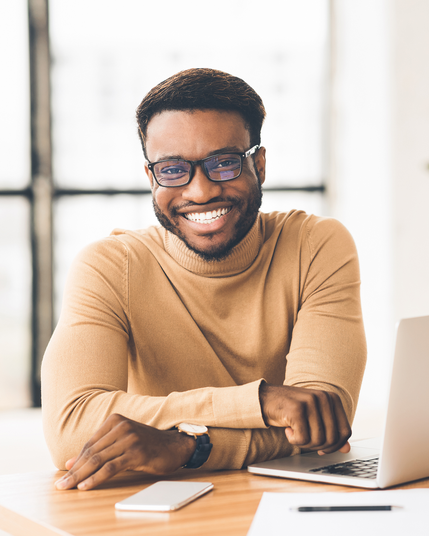 Happy Businessman Looking At Camera Smiling